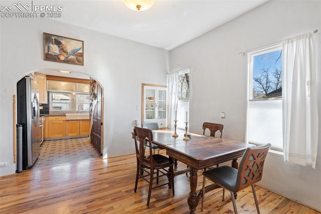 Image 9 of 37: Dining space featuring plenty of natural light and light wood finished floo