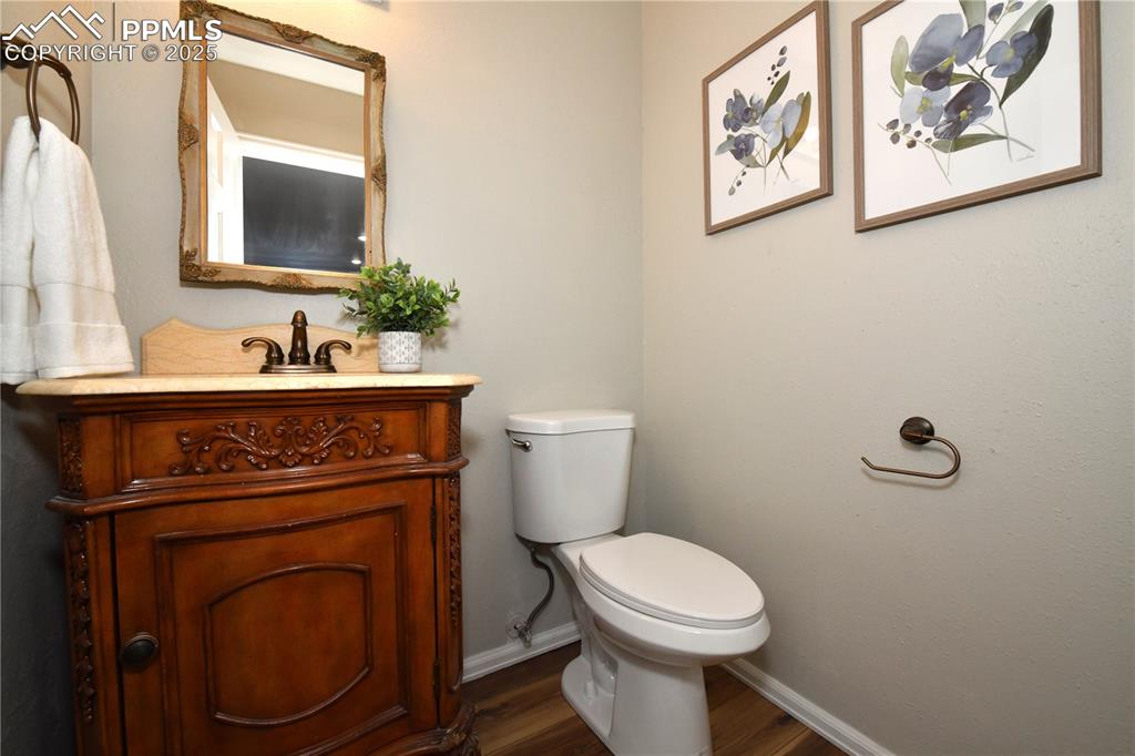 Image 17 of 36: Bathroom featuring vanity and wood finished floors