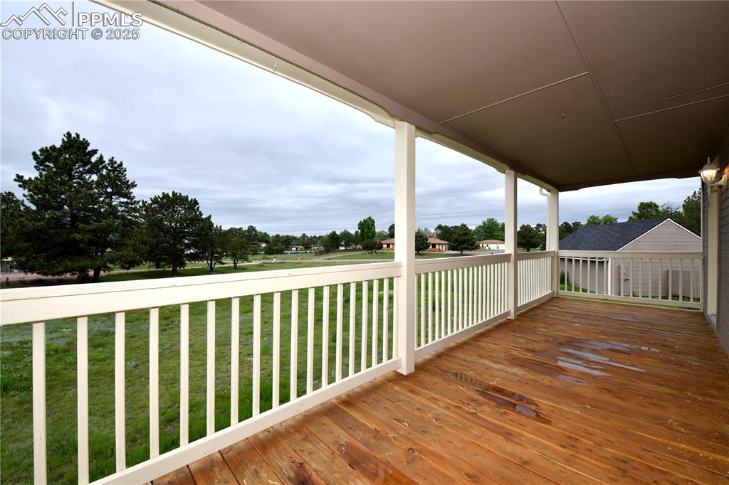 Image 5 of 36: Deck featuring a lawn