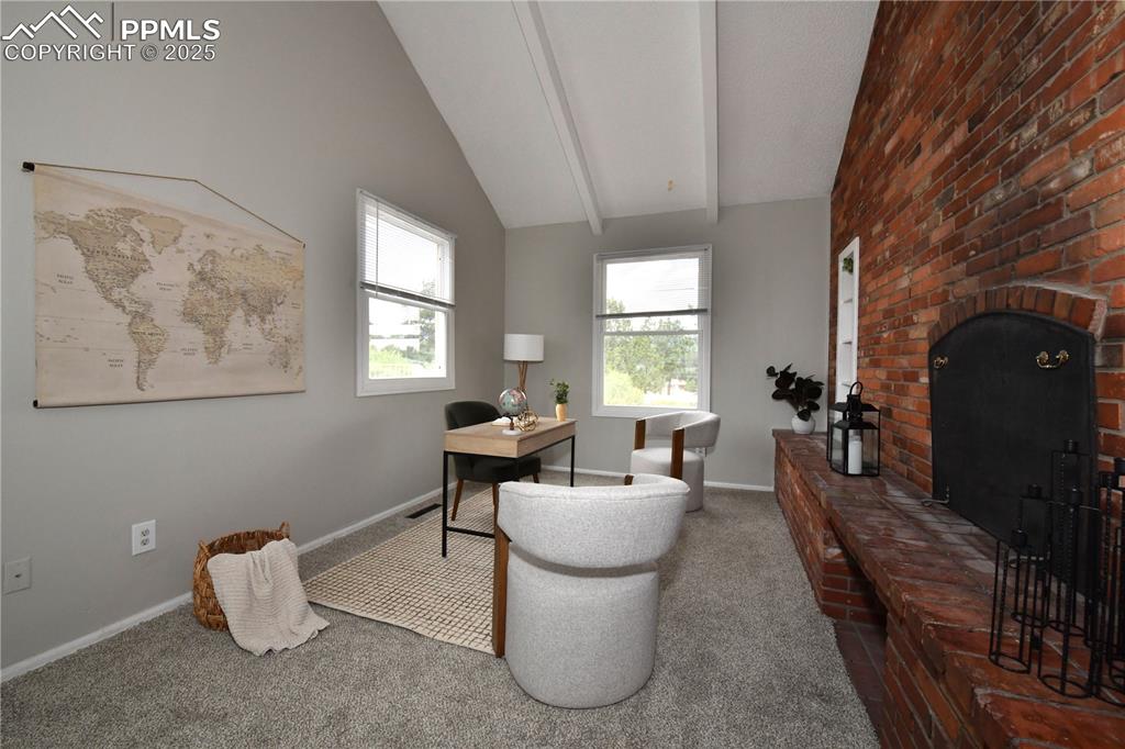 Image 9 of 36: Carpeted office space with baseboards