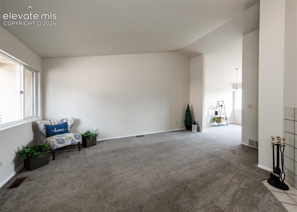 Image 9 of 36: Vaulted ceilings with recessed lighting, large window with natural light, n