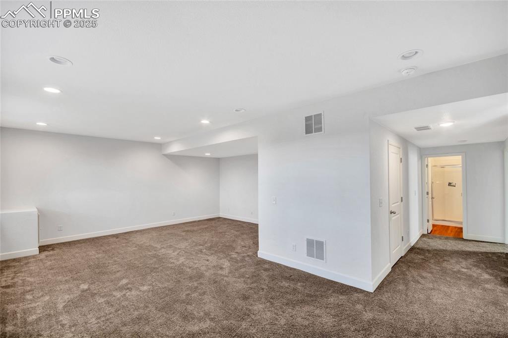 Image 26 of 46: Spare room featuring recessed lighting and carpet flooring
