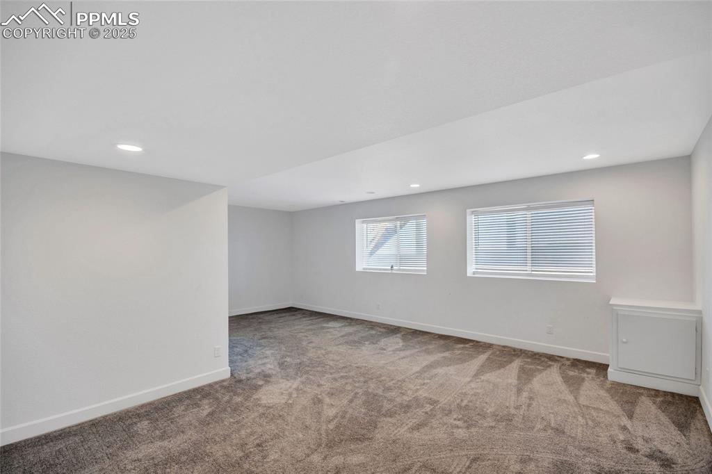Image 27 of 46: Carpeted spare room with recessed lighting