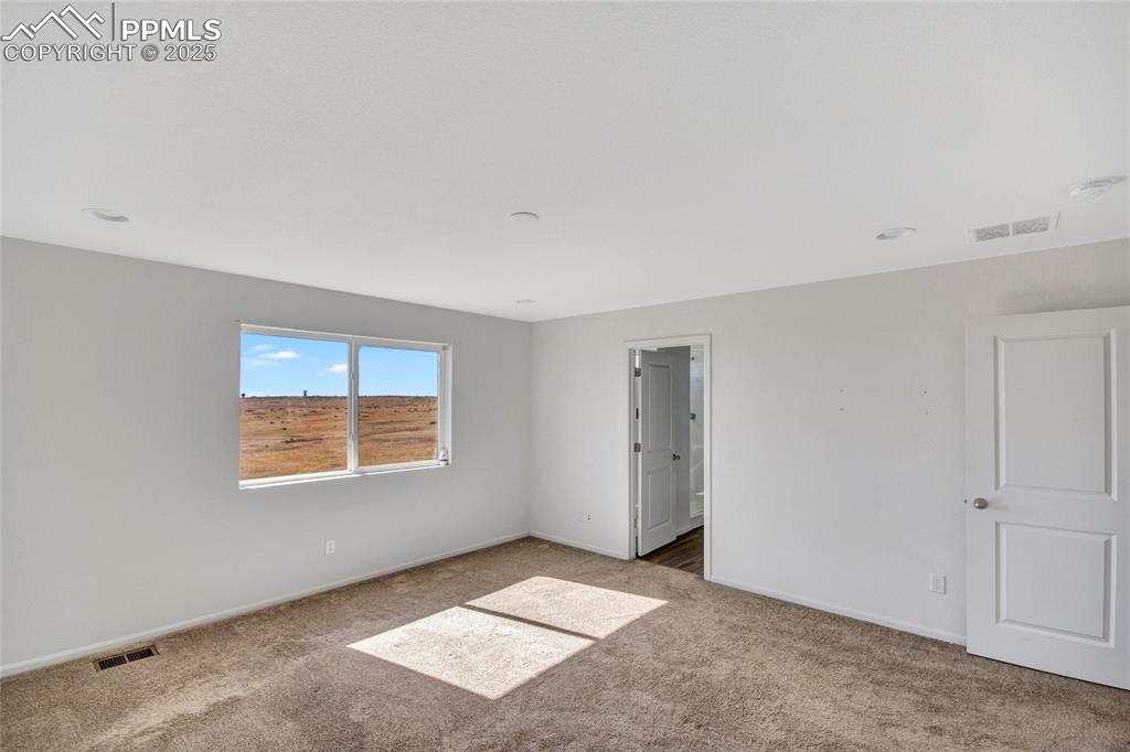 Image 33 of 46: Unfurnished bedroom featuring carpet and recessed lighting