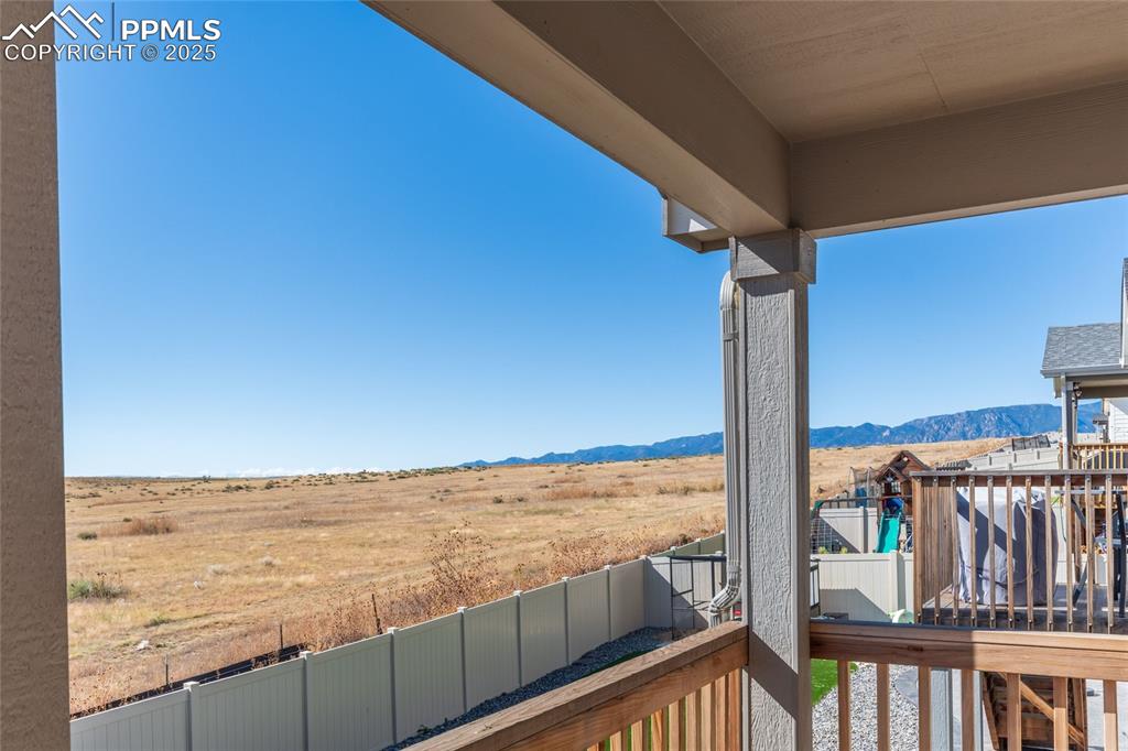 Image 9 of 46: Balcony featuring a view of countryside and a mountain view