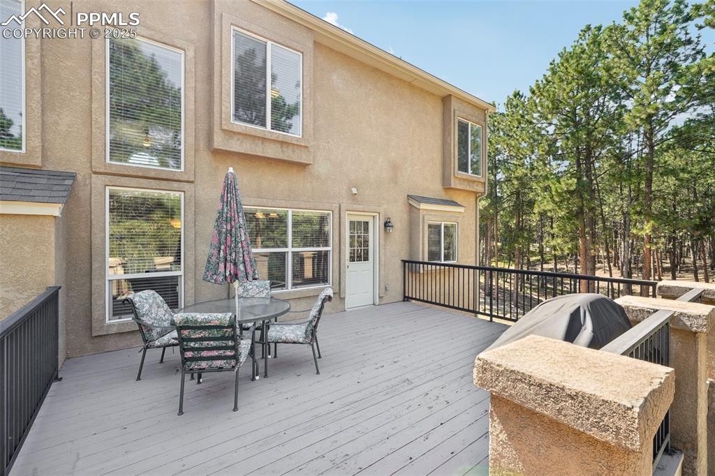 Image 38 of 45: Wooden deck featuring outdoor dining area