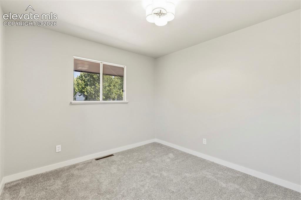 Image 27 of 46: Light taupe carpeting and painted walls