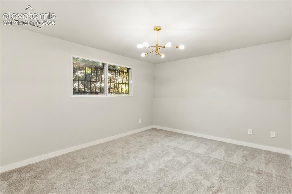 Image 34 of 46: Open recreation room at lower level