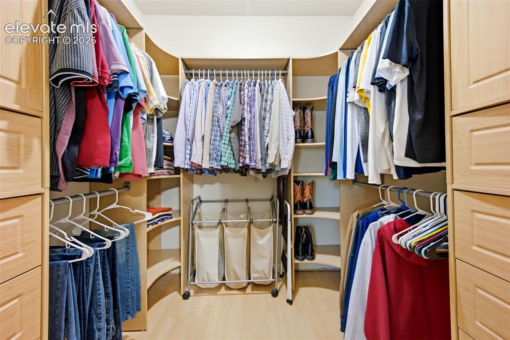 Image 25 of 42: Primary Walk in closet