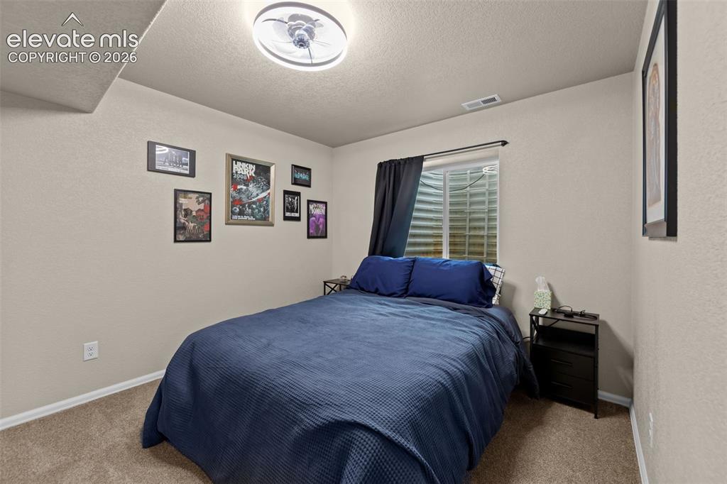 Image 26 of 41: Neutral wall tones, recessed window, and light-colored carpeting