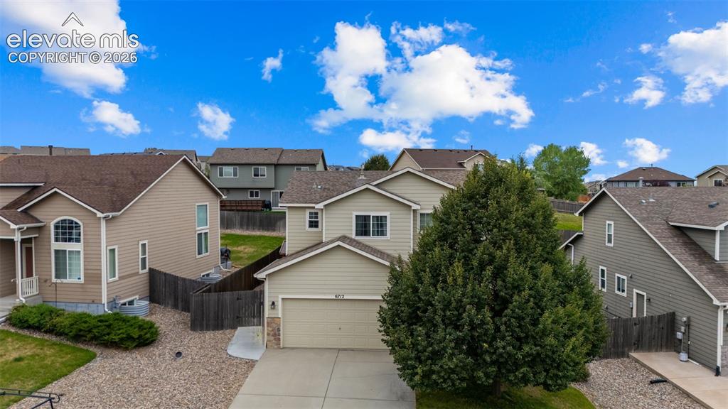Image 33 of 41: Contemporary two-story residence with attached garage, durable siding exter