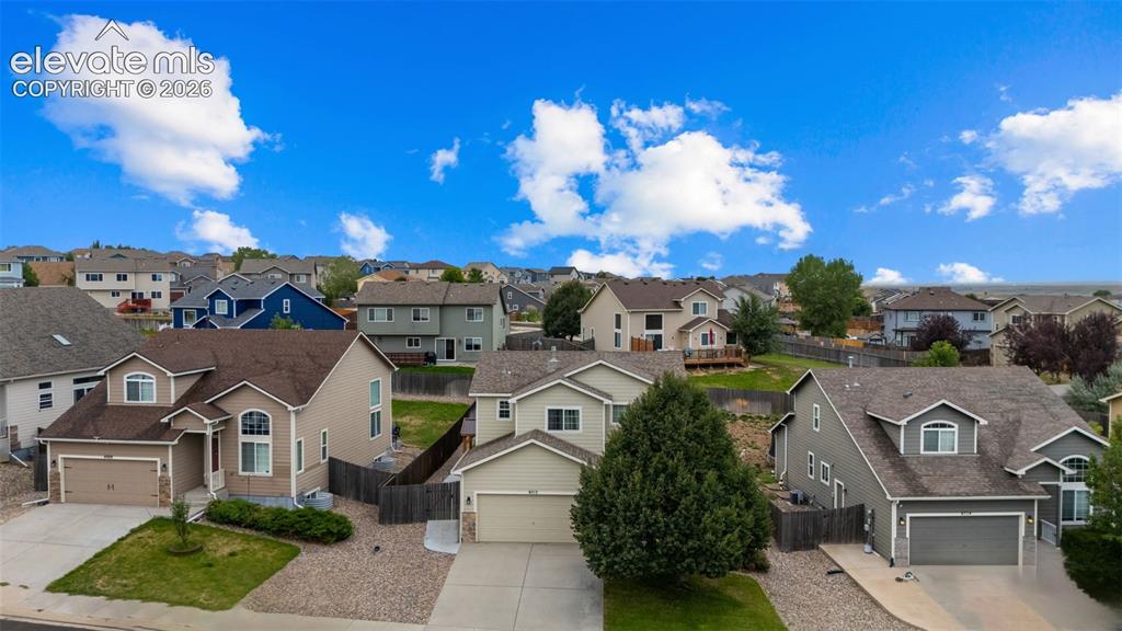 Image 35 of 41: Residential neighborhood featuring multiple detached homes with various ext
