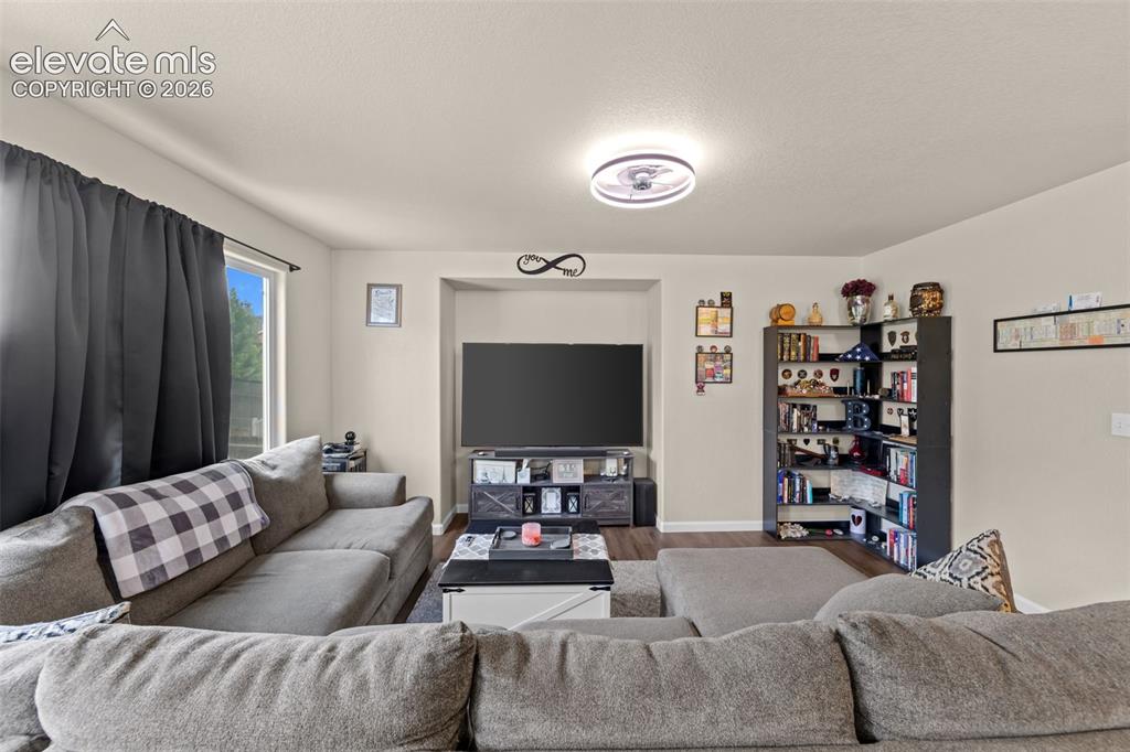 Image 6 of 41: Recessed media niche, modern ceiling light fixture, neutral wall color, woo
