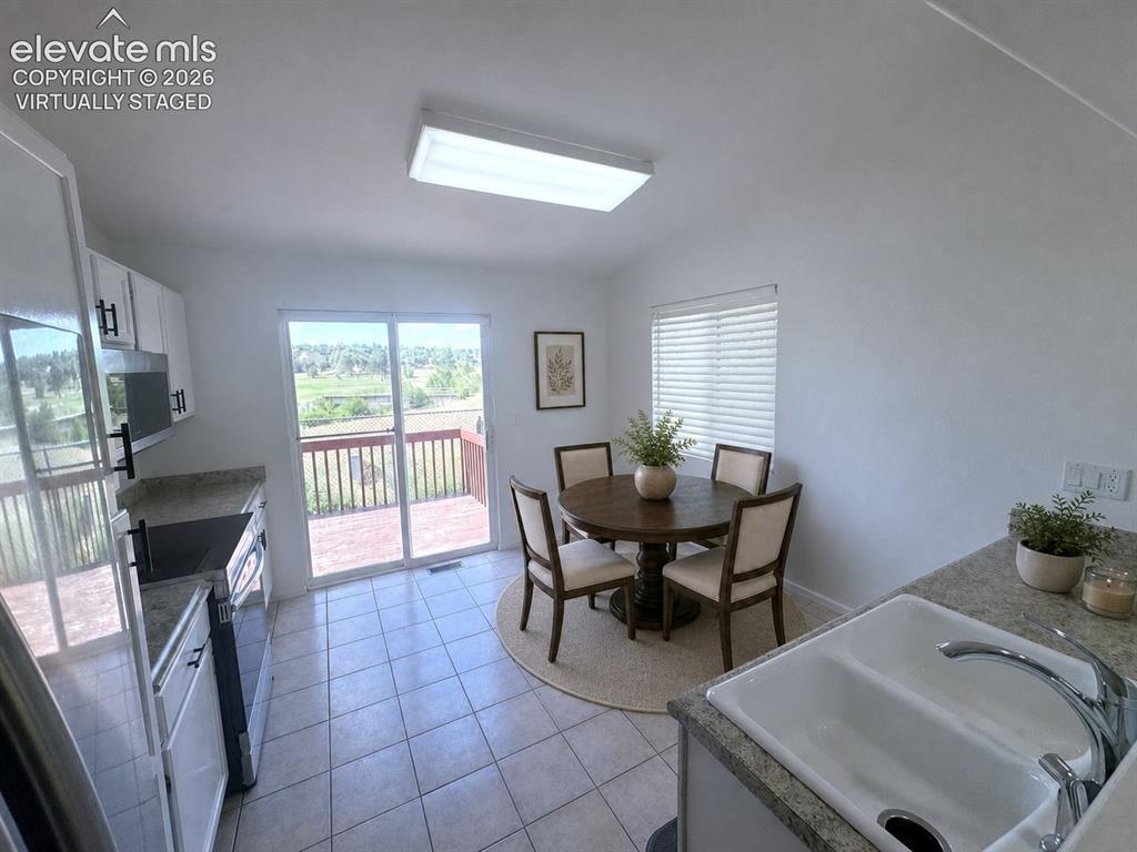 Image 12 of 36: Dining - virtually staged