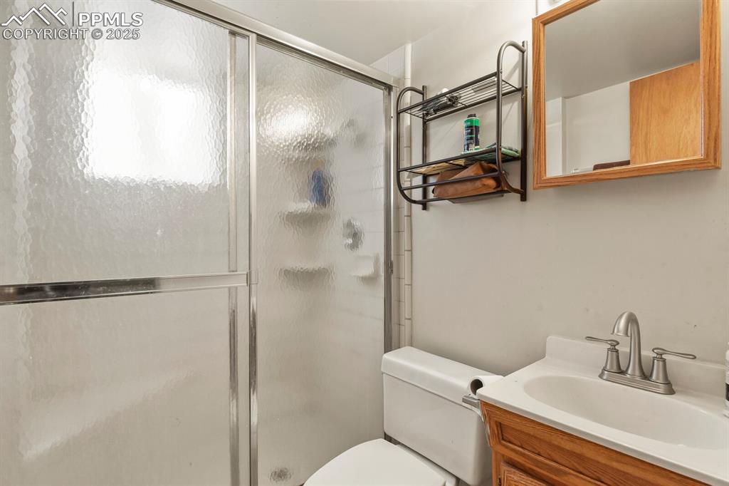 Image 19 of 30: Full bath featuring a stall shower and vanity