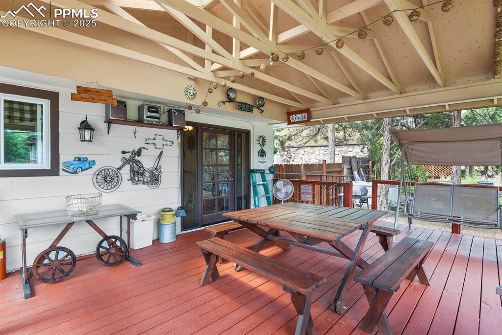 Image 23 of 30: Wooden deck featuring outdoor dining space