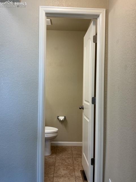 Image 14 of 37: Powder room off main area
