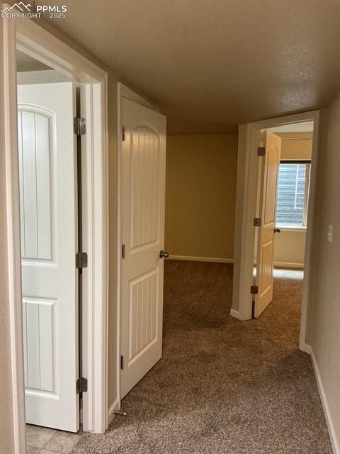 Image 35 of 37: Corridor looking out into family room, bath  area in basement