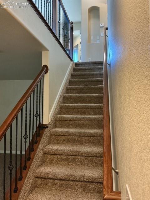 Image 37 of 37: Stairs with baseboards