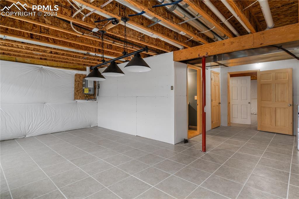 Image 24 of 30: Basement with tile floors