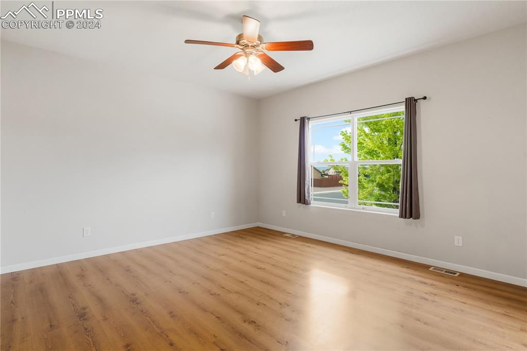Image 5 of 30: Spare room featuring ceiling fan and light hardwood / wood-style floors
