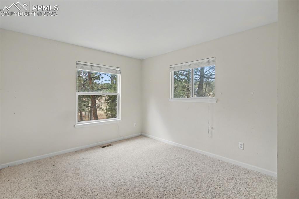 Image 18 of 49: Spare room with carpet flooring and baseboards