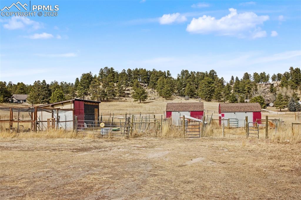 Image 33 of 49: View of yard featuring an outdoor structure and a view of rural / pastoral
