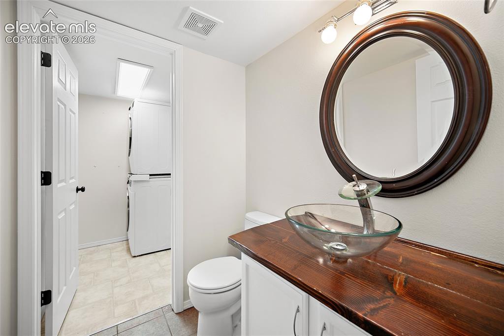 Image 18 of 49: main level bathroom + laundry