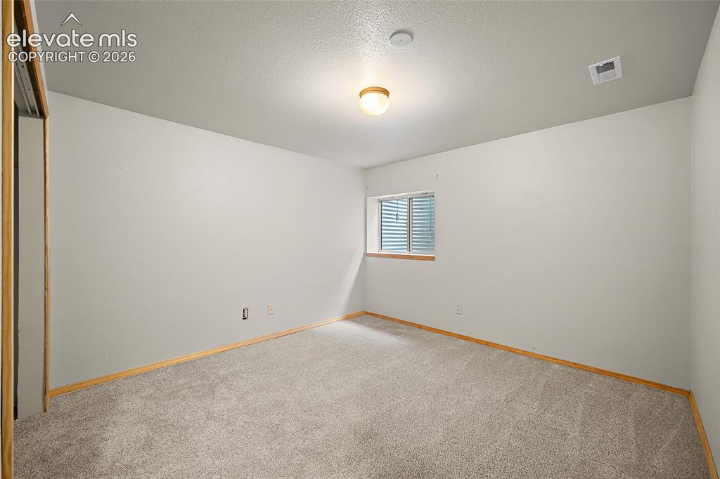 Image 34 of 49: Bedroom #4 in basement
