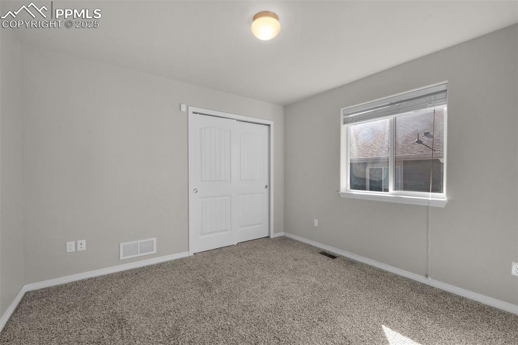 Image 22 of 38: Secondary main level bedroom #3