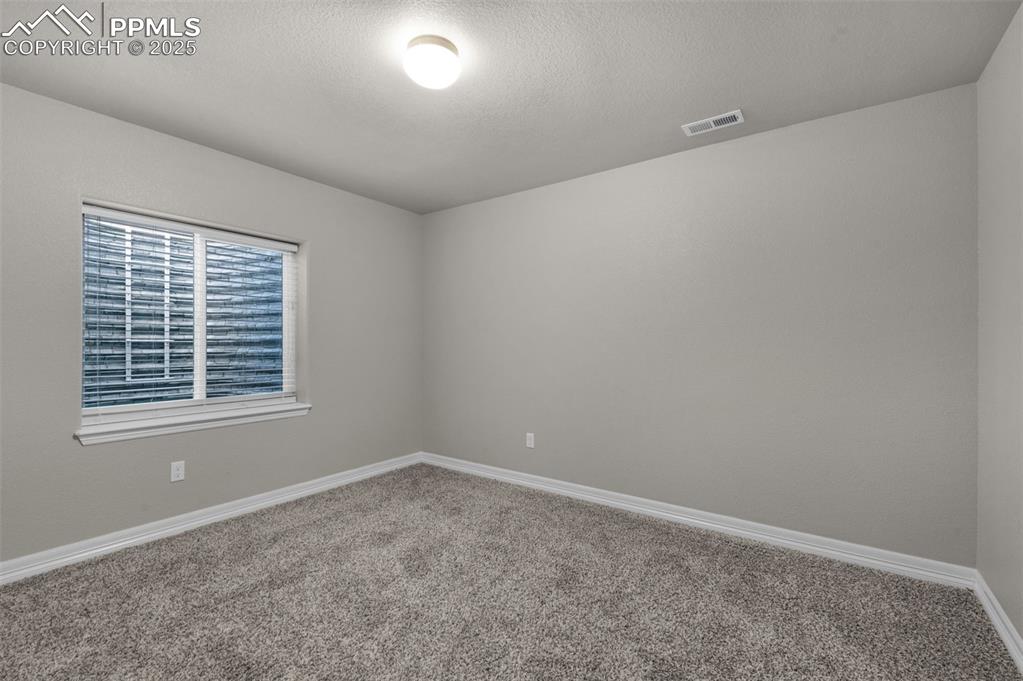 Image 28 of 38: Basement bedroom