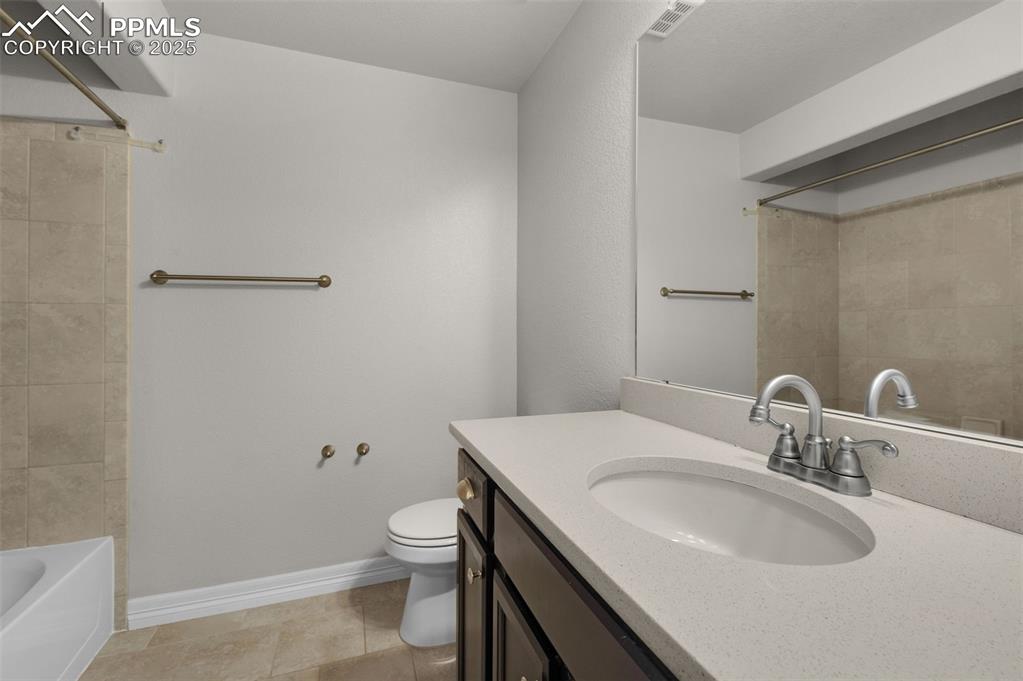 Image 31 of 38: Full bathroom with vanity, shower / tub combination