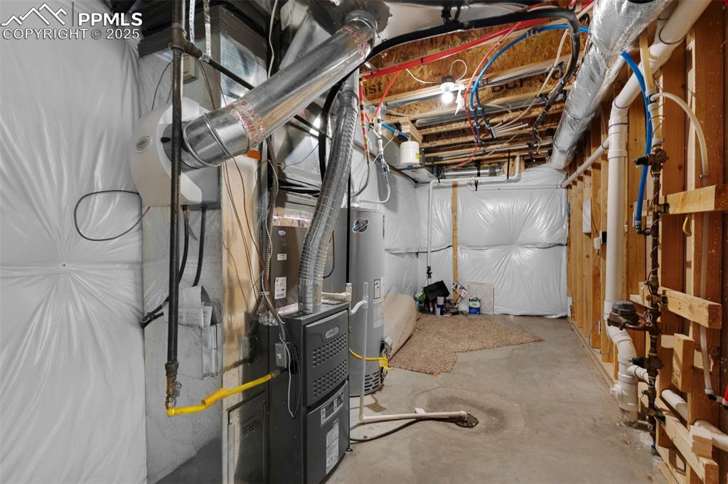 Image 32 of 38: Utilities featuring gas water heater