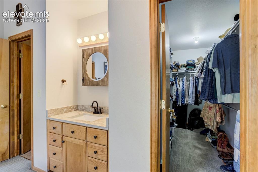 Image 15 of 43: Primary Vanity and Primary Closet-Upstairs