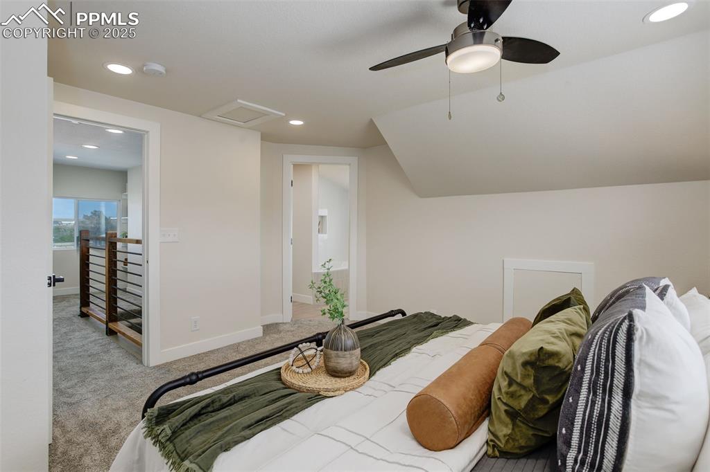 Image 28 of 50: Carpeted bedroom featuring recessed lighting, baseboards, a ceiling fan, an