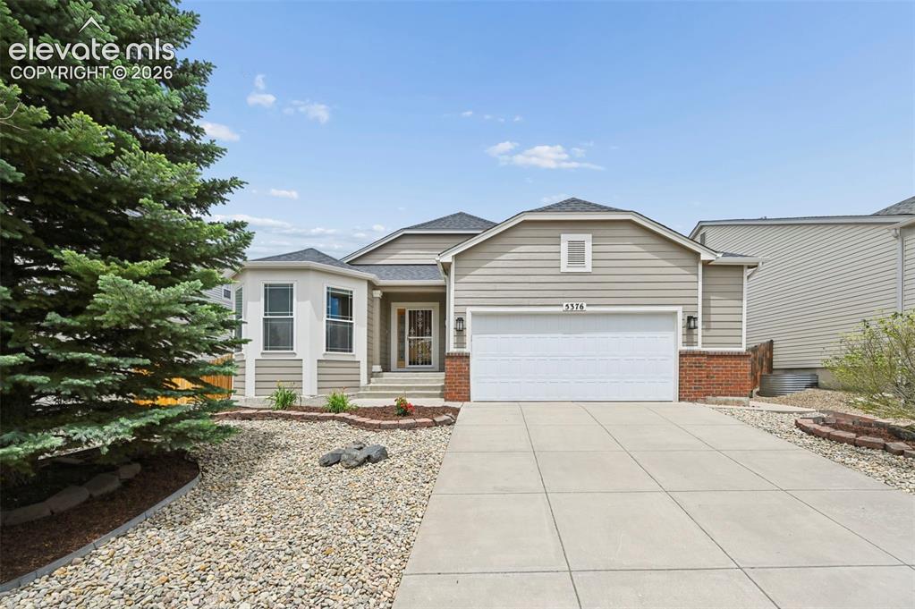 Image 32 of 32: Contemporary ranch-style residence featuring a two-car garage, bay window,