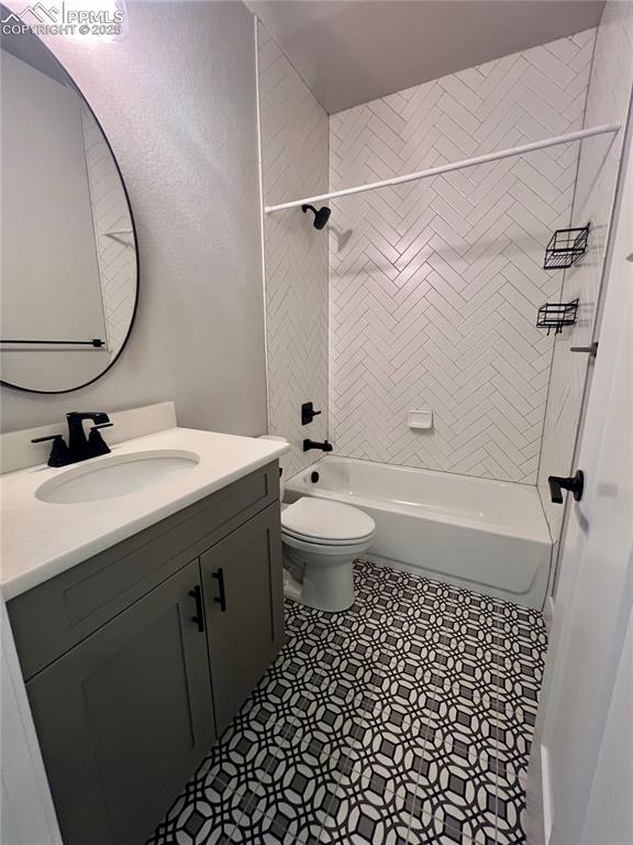 Image 2 of 19: Full bath with vanity, shower / tub combination, and a textured wall