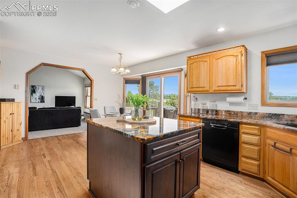 Image 14 of 49: Open floorpan connecting dining and living areas
