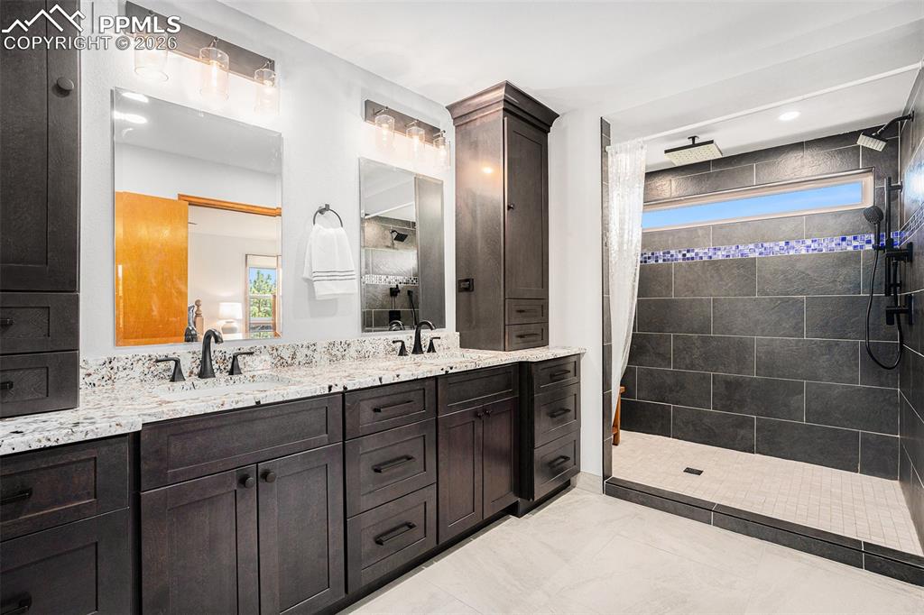 Image 22 of 49: Enjoy the gorgeous remodeled en-suite bathroom, oversized walk-in shower an