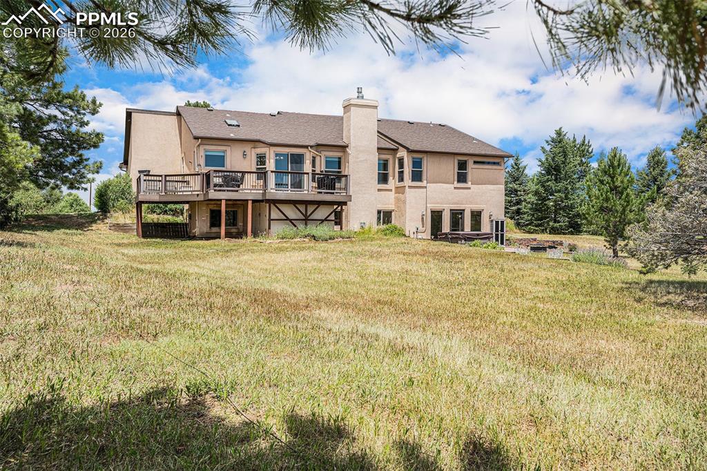 Image 34 of 49: Enjoy mature trees and fenced acreage designed for both recreation and hors