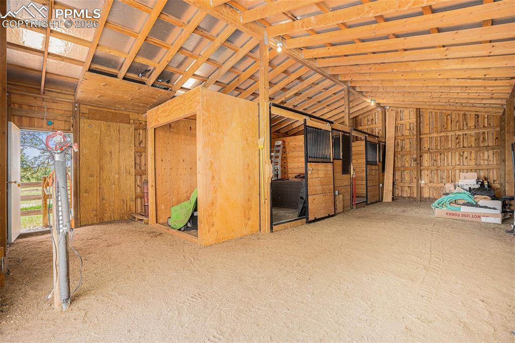 Image 38 of 49: 2- 12 X 12 stalls with rubber mats and 
swing out combo feeder for grain a