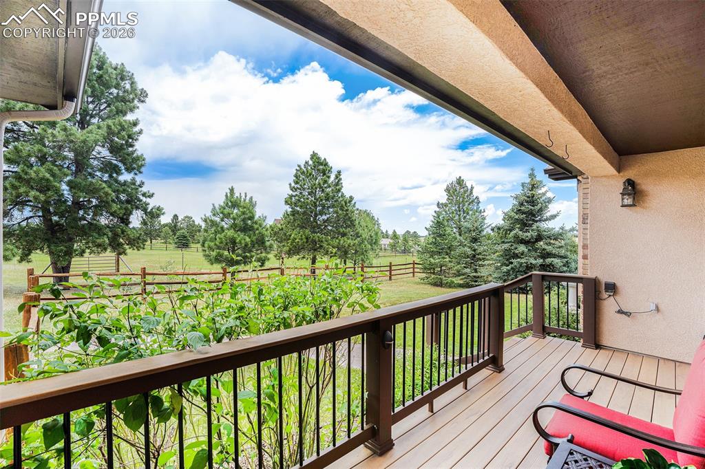 Image 4 of 49: Covered front porch to enjoy Colorado