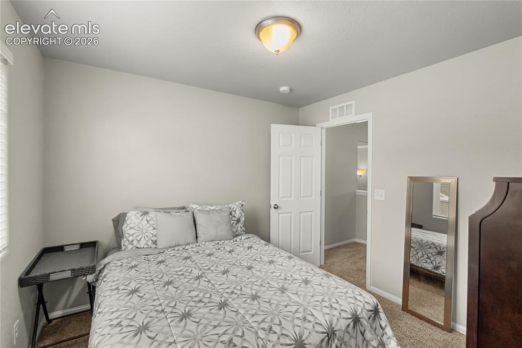 Image 14 of 34: Upstairs bedroom