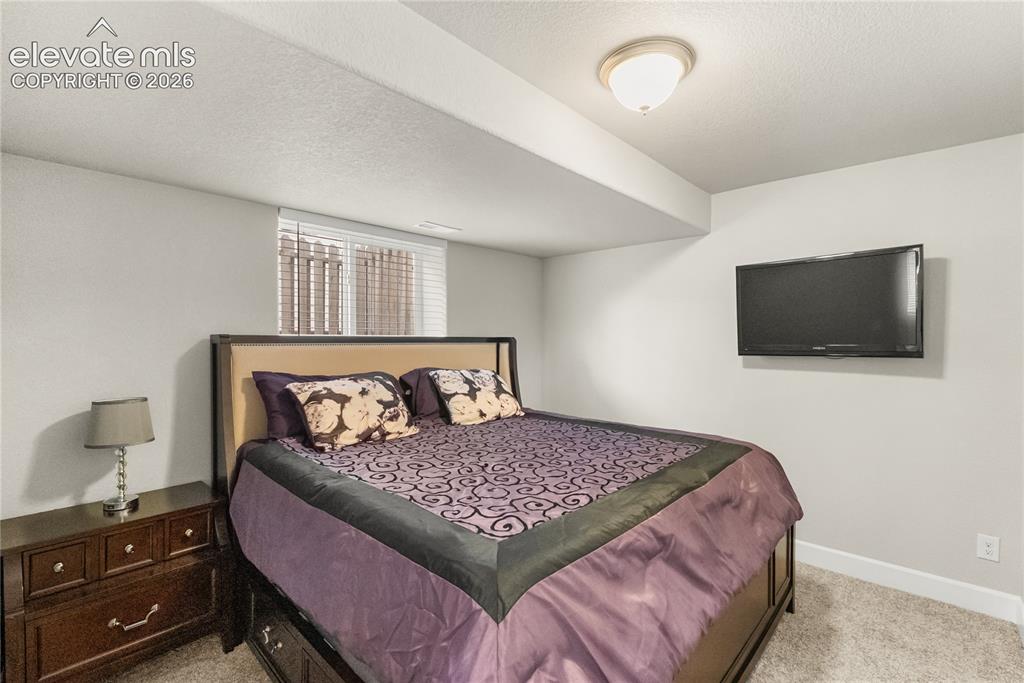 Image 22 of 34: Basement bedroom