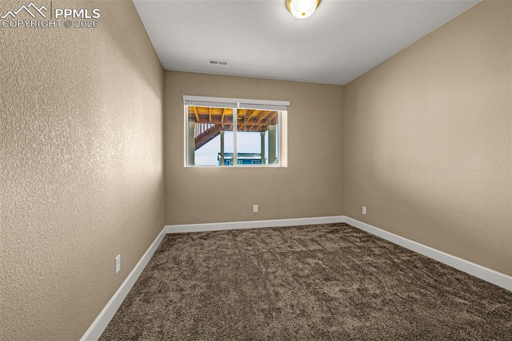 Image 40 of 46: Basement Bedroom