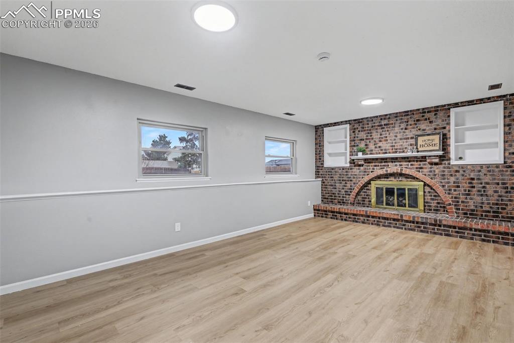 Image 10 of 28: Wood burning fireplace