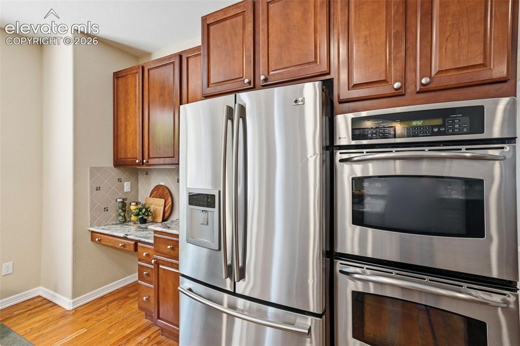 Image 15 of 50: Stainless steel appliances and double oven