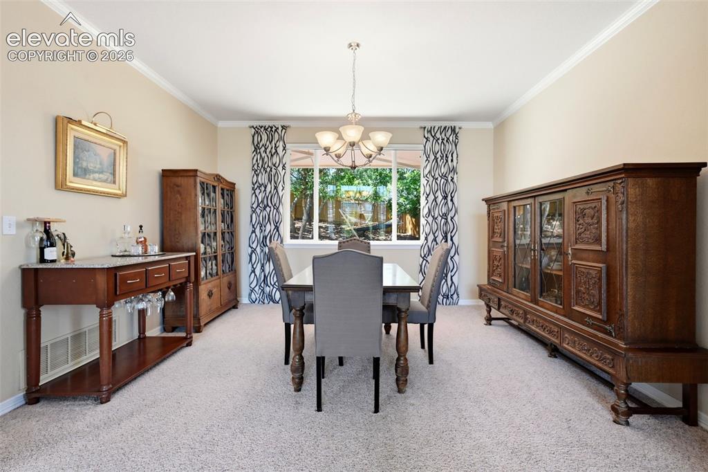 Image 18 of 50: Enjoy entertaining in the lovely formal dining area, just off the living ro