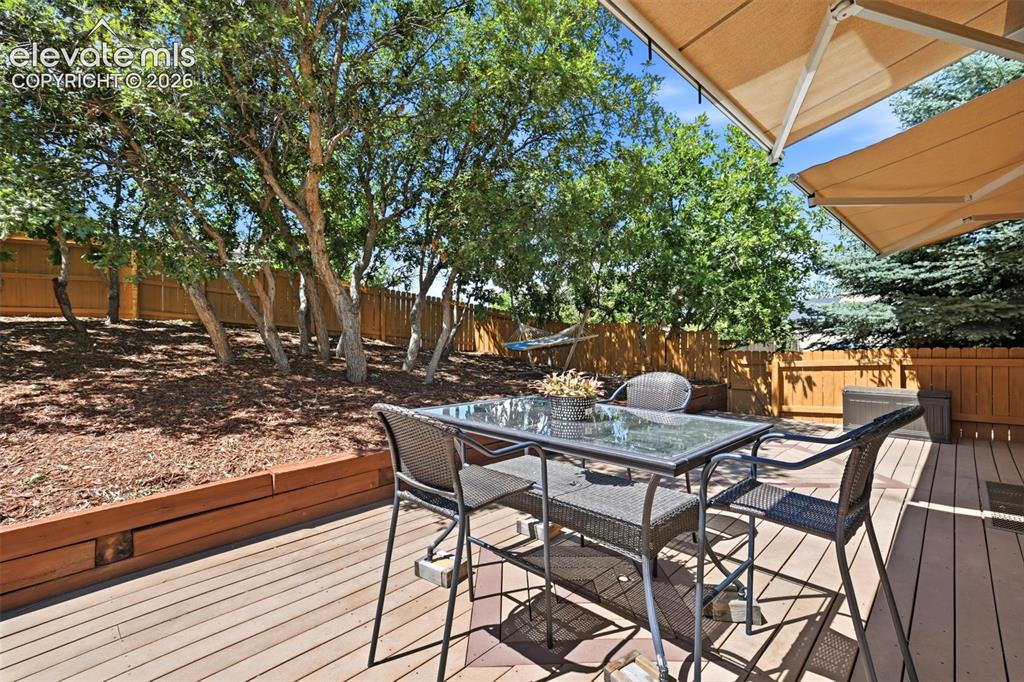 Image 20 of 50: Enjoy the peaceful backyard and expandable sun shades over the deck!