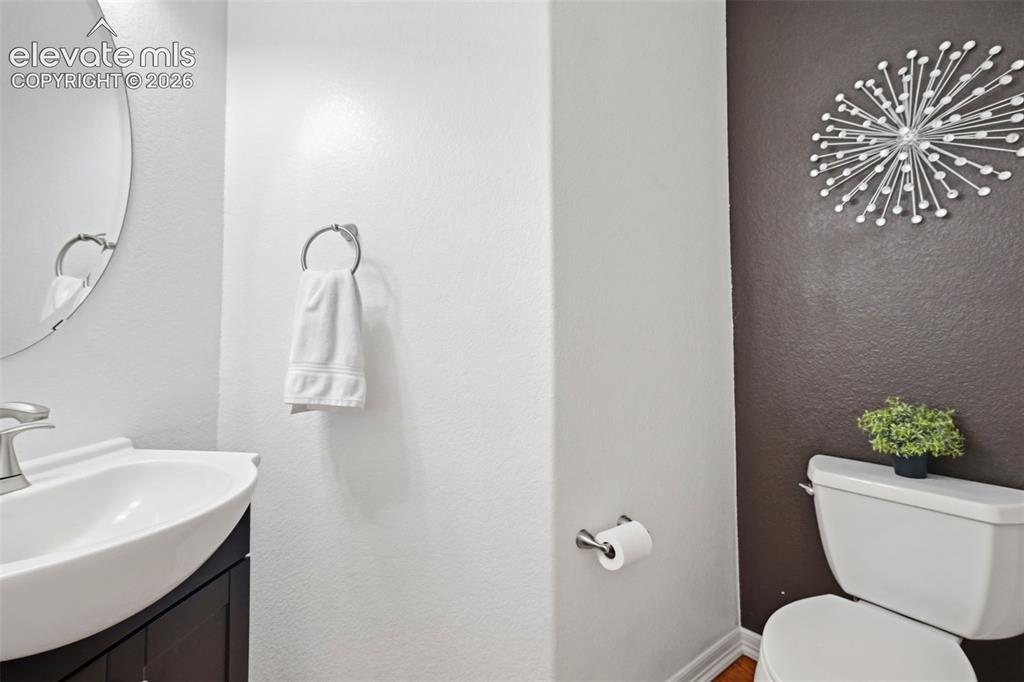 Image 29 of 50: Updated half-bath on main flloor